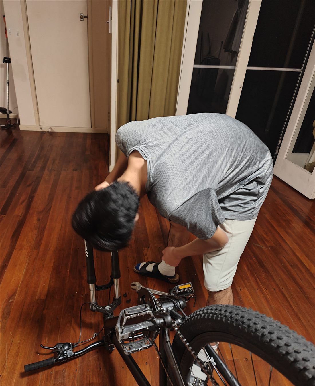 Leo repairing a commuter bicycle